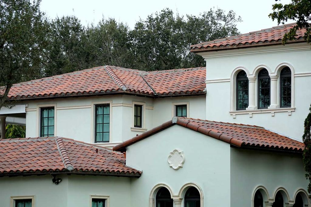 A Mediterranean-style home with a terracotta clay tile roof
