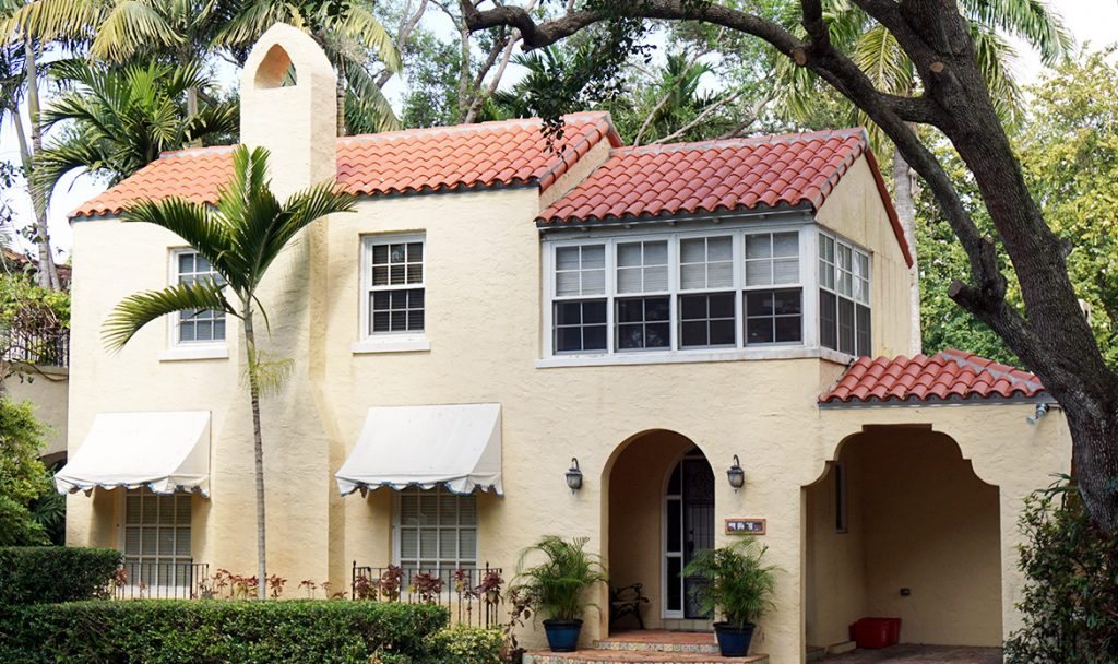A Spanish-style Miami home with a red clay barrel tile roof