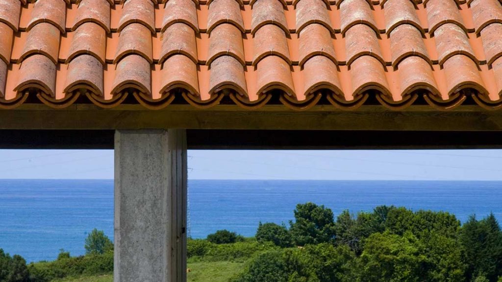 Clay roof tiles with the sea beyond